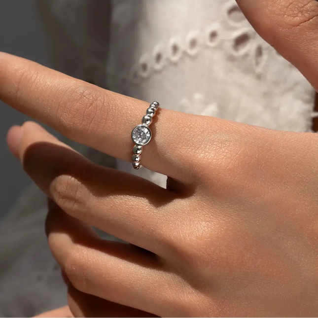 0.5Ct Moissanite Rings 925 Sterling Silver on a hand showcasing elegance and beauty.