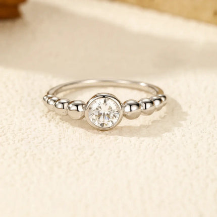 0.5Ct Moissanite Rings 925 Sterling Silver featuring a round moissanite in a smooth bezel setting.