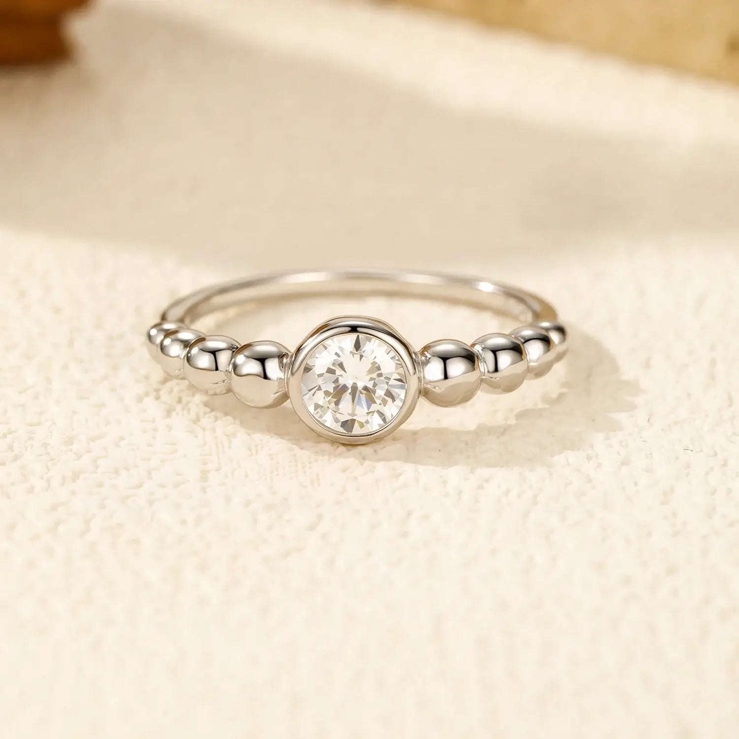 0.5Ct Moissanite Rings 925 Sterling Silver featuring a round moissanite in a smooth bezel setting.