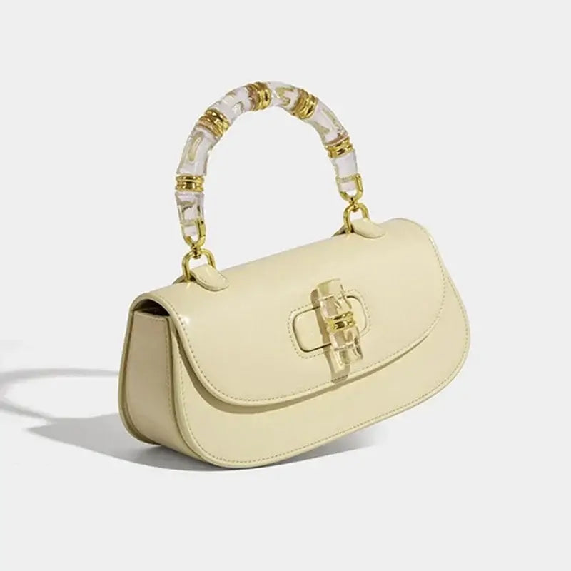Fashion women's handbag in elegant yellow with a bamboo handle, featuring high-grade leather, perfect for a stylish look.
