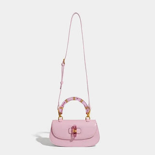 Pink women's handbag with bamboo handle, high-grade leather, and exquisite one-shoulder style, perfect for fashion lovers.