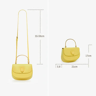 Yellow leather handbag with adjustable strap, showcasing dimensions for style and convenience.