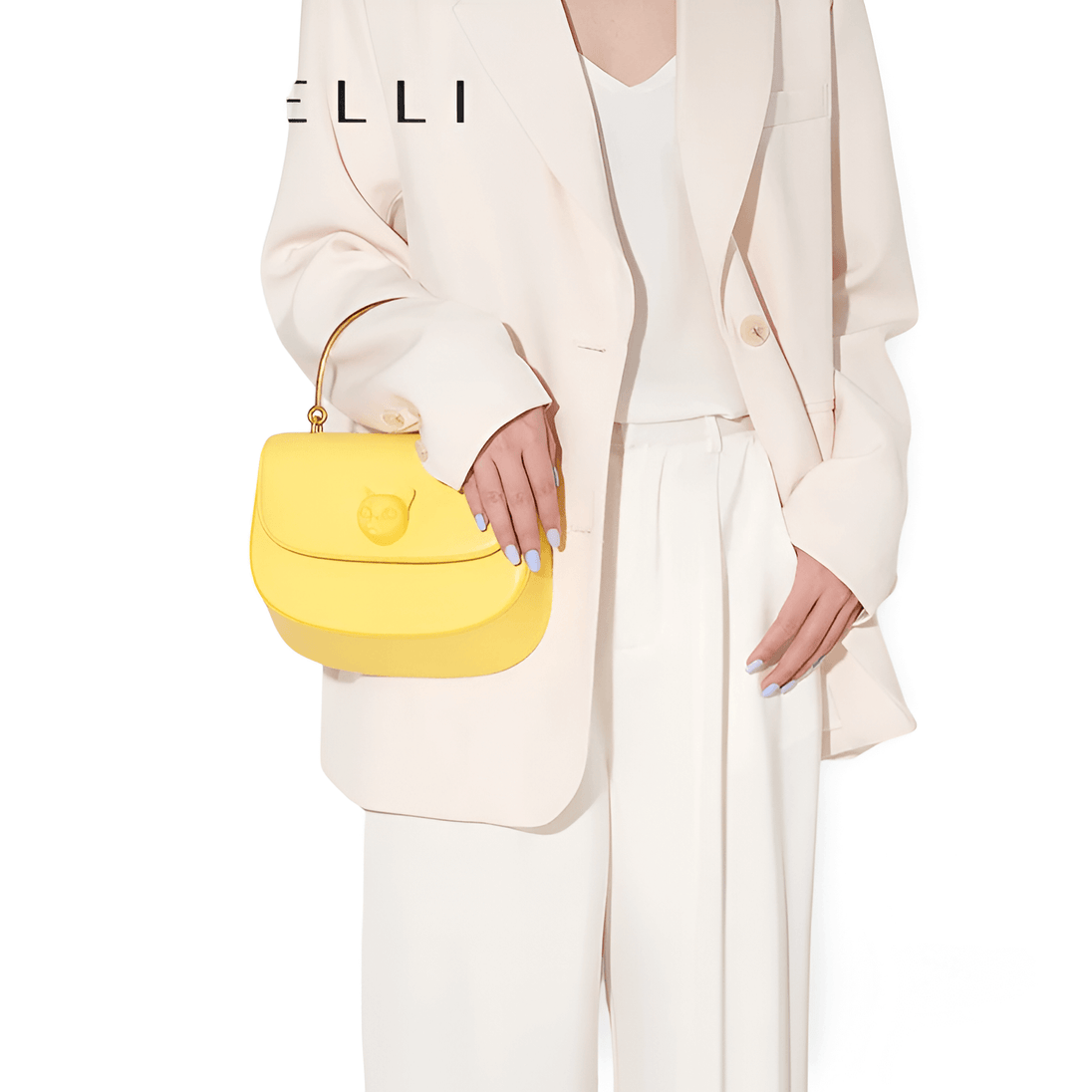 Yellow Women's Handbag with Decorative Cat Emblem, Stylish Metal Handle, Perfect for Everyday Use.