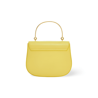 Yellow women’s handbag with gold handle, featuring a sleek half-moon design and minimalistic style.