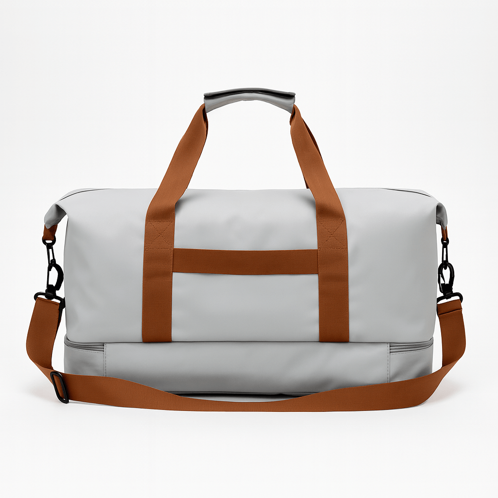 Gym Bag with Shoe Compartment in grey with brown straps for durable travel and gym use.
