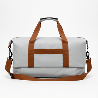 Gym Bag with Shoe Compartment in grey with brown straps for durable travel and gym use.