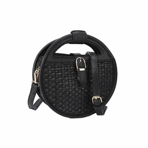 Black round leather shoulder bag with woven texture and adjustable strap, stylish and practical for everyday use.