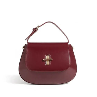 Shoulder Bag Leather, elegant burgundy saddle bag with gold hardware, perfect for casual or refined outfits.