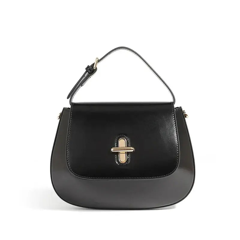 Shoulder Bag Leather - Black genuine leather saddle bag with decorative lock and structured shape.