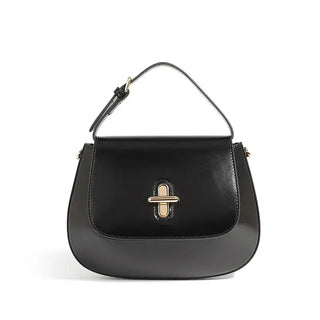 Shoulder Bag Leather - Black genuine leather saddle bag with decorative lock and structured shape.