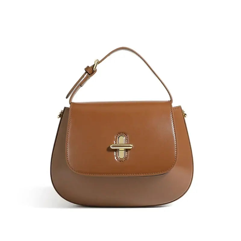 Elegant brown leather shoulder bag with decorative lock, perfect for casual and refined styles.