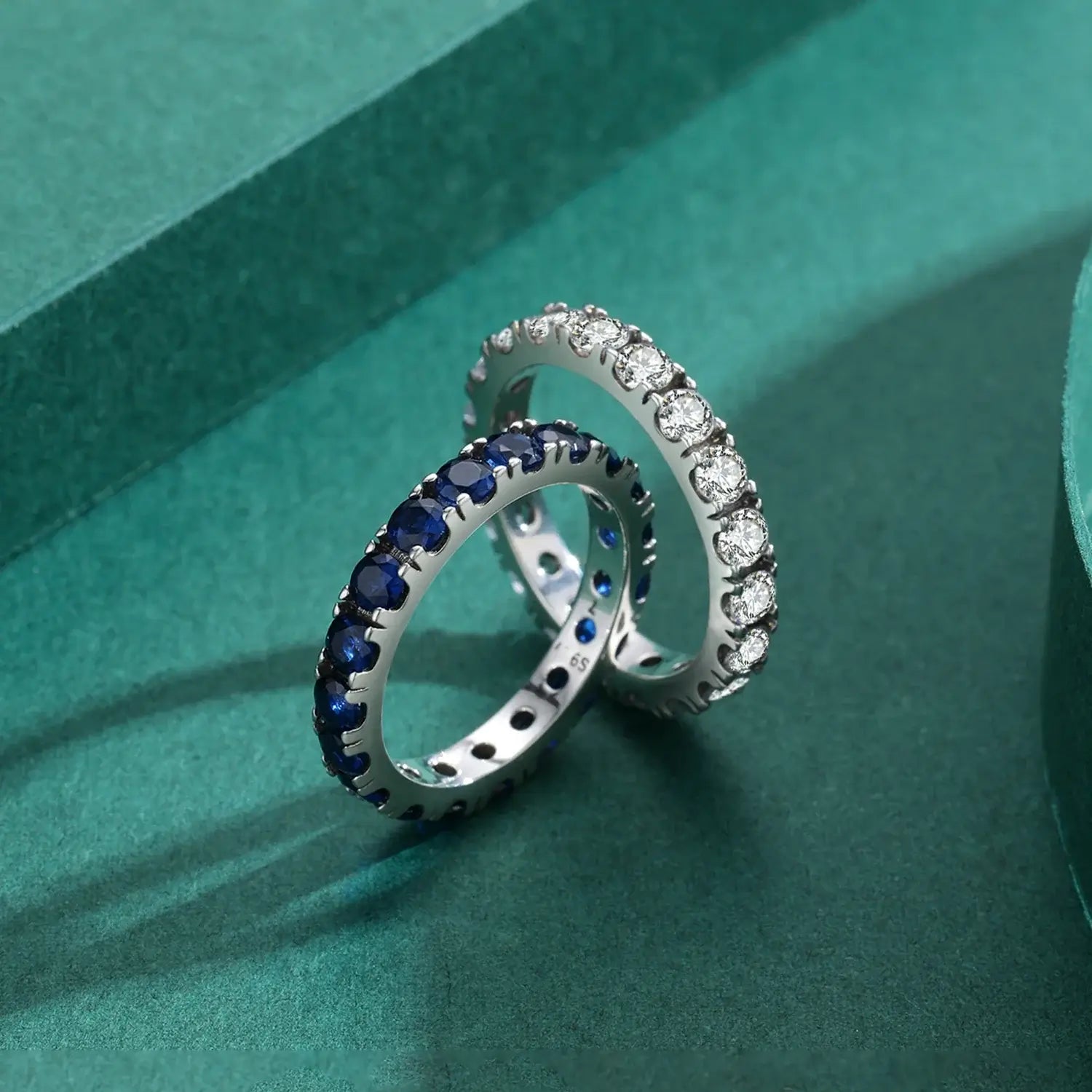 Classic Round Zircon Ring 925 Sterling Silver alongside two elegant band rings.