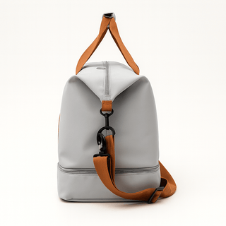 Gym Bag with Shoe Compartment in gray with brown accents, ideal for gym and travel.