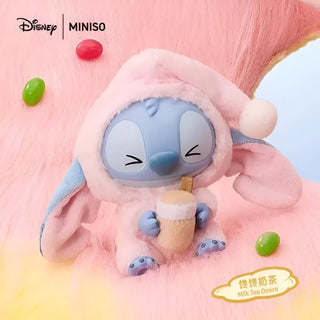 Disney Lilo Stitch toy - blue vinyl doll in pink bunny outfit, perfect for collectors and kids.