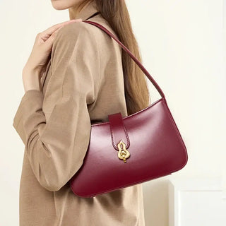 Shoulder bag leather in burgundy with zipper, stylish half-moon design, perfect for versatile outfits and occasions.