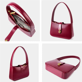 Burgundy leather shoulder bag with zipper and lock closure, showcasing a stylish and functional half-moon design.