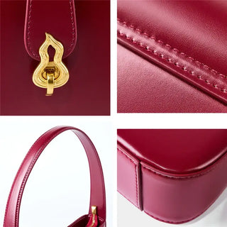 Sophisticated burgundy leather shoulder bag zipper with decorative lock, showcasing premium craftsmanship and minimalist design.