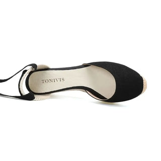 Black espadrille sandals for women by TONIVIS, featuring a comfortable cross-strap design.