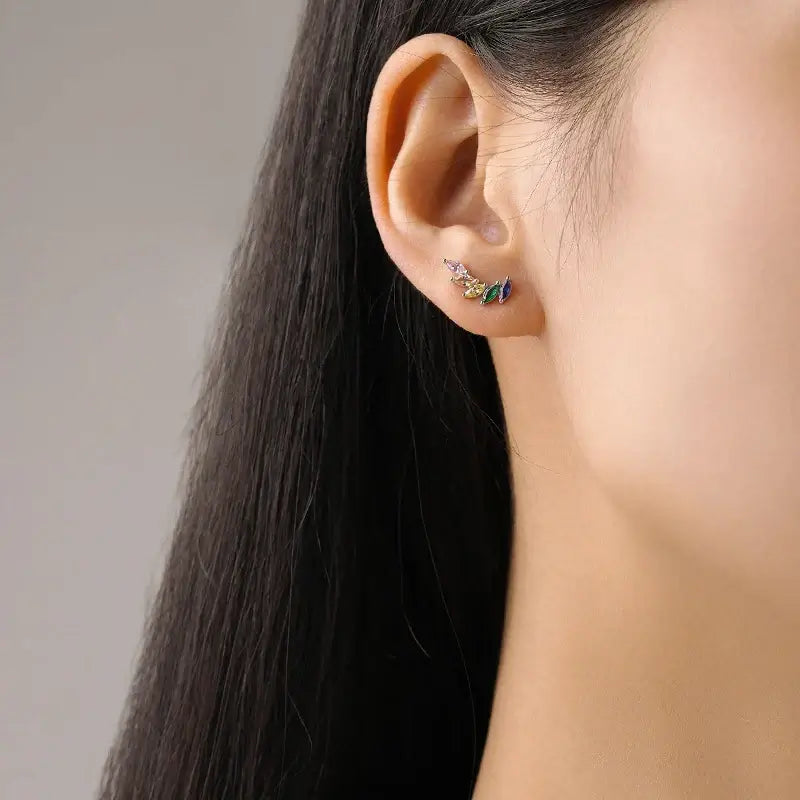 Feather Zircon Crystal Stud Earrings 925 Sterling Silver worn in ear showcasing elegant design and sparkling details.
