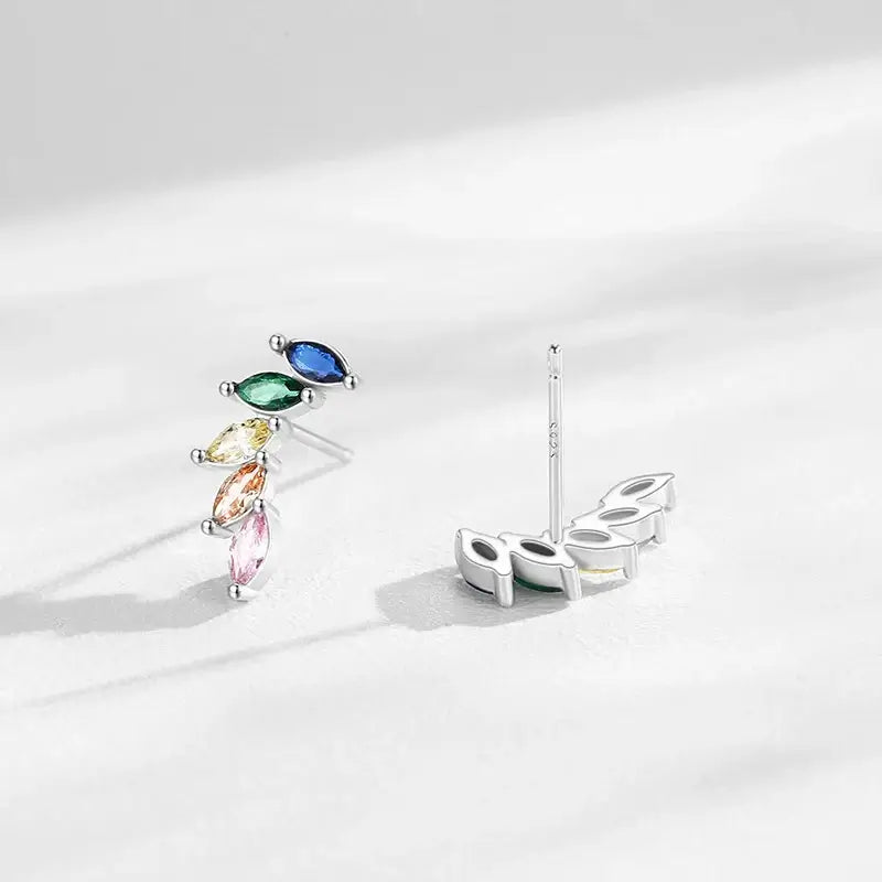 Feather Zircon Crystal Stud Earrings 925 Sterling Silver displayed against a soft background, showcasing colorful stones.