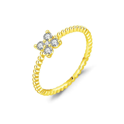 Four Leaf Clover Moissanite Ring 925 Sterling Silver in yellow gold with sparkling stones.
