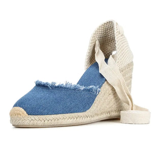 Women's Denim Espadrilles with lace-up ankle straps in blue denim and woven wedge heels.