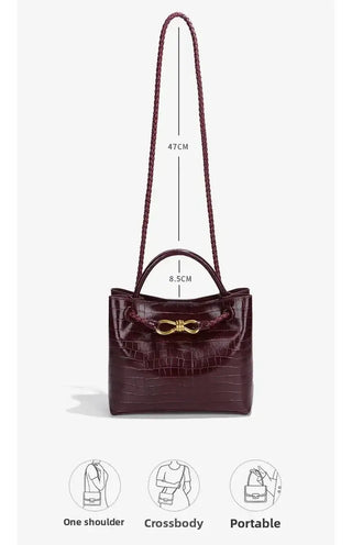 Vintage Women's Handbag in burgundy, featuring stylish design and adjustable straps, perfect for modern women.