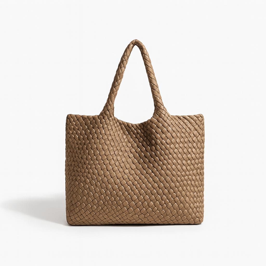 Woven shoulder bag in brown faux leather with spacious design and stylish criss-cross pattern, perfect for everyday use.