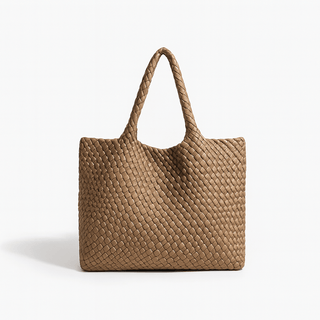Woven shoulder bag in brown faux leather with spacious design and stylish criss-cross pattern, perfect for everyday use.