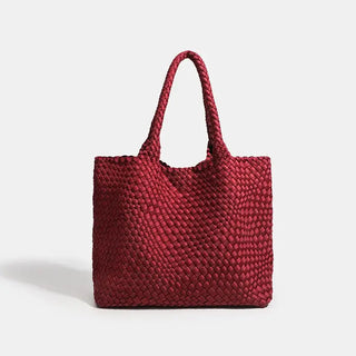 Woven shoulder bag in red, featuring a stylish criss-cross pattern and two sturdy handles, perfect for everyday use.
