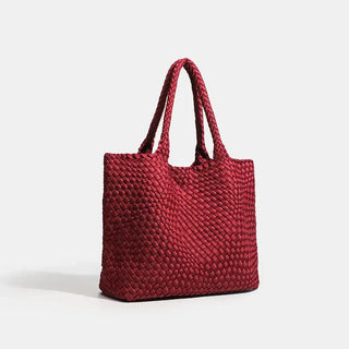 Woven shoulder bag in red with dual handles, featuring a stylish and functional design for everyday use.