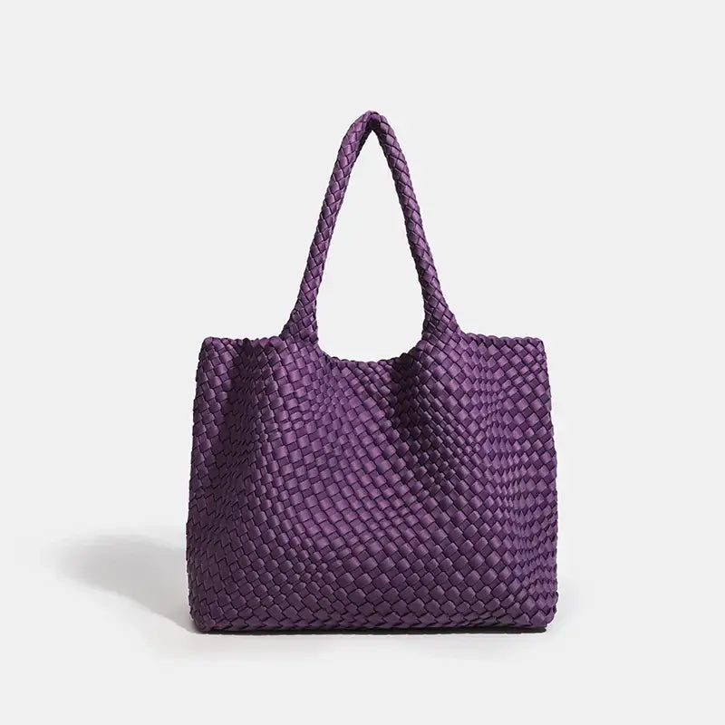 Purple woven shoulder bag with soft structure and stylish design, perfect for everyday use.