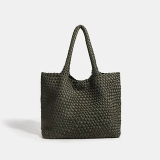 Woven shoulder bag in olive green with flap pocket, combining style and functionality for everyday use.