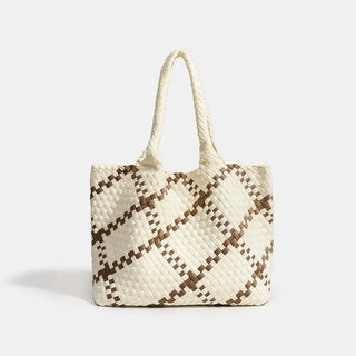 Woven shoulder bag in cream and brown with flap pocket, ideal for stylish everyday use.