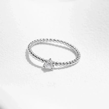 Heart Moissanite Engagement Rings featuring a heart-shaped moissanite in a beaded sterling silver band.