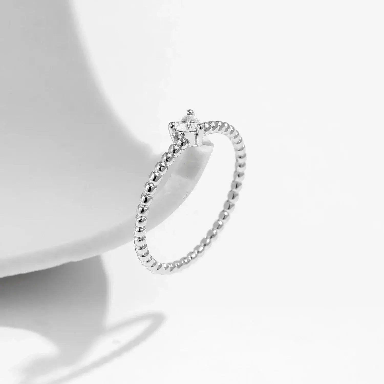 Heart Moissanite Engagement Rings showcasing a heart-shaped moissanite in a prong setting on a sterling silver band.