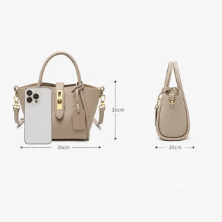 Women's Genuine Leather Bucket Bags showcasing a stylish design and dimensions with a smartphone for size reference.