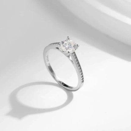 Lab Diamond 1CT Moissanite Ring showcased in elegant light with sparkling round moissanite and delicate band.