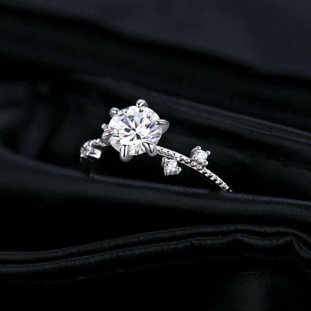 Lab Diamond Moissanite Ring 925 Sterling Silver with round moissanite in classic prong setting on black fabric.