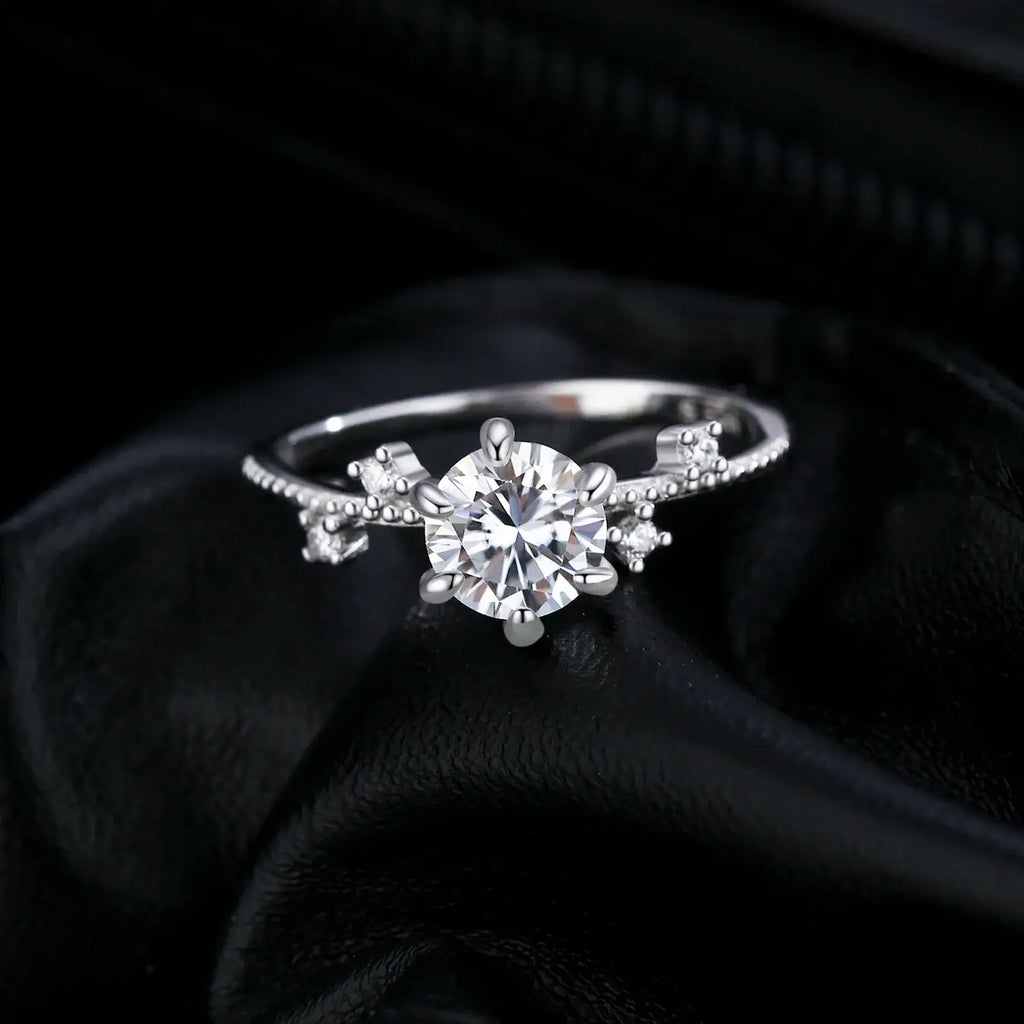 Lab Diamond Moissanite Ring 925 Sterling Silver with round moissanite in classic prong setting on black background.