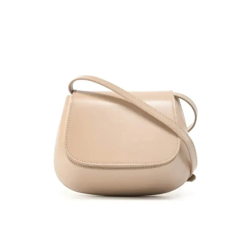 Shoulder bag leather in beige - Versatile, stylish saddle bag for casual outings and elegant evenings.