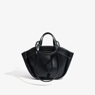 Black tote bag with soft leather finish and dual handles, ideal for casual outings and everyday use.