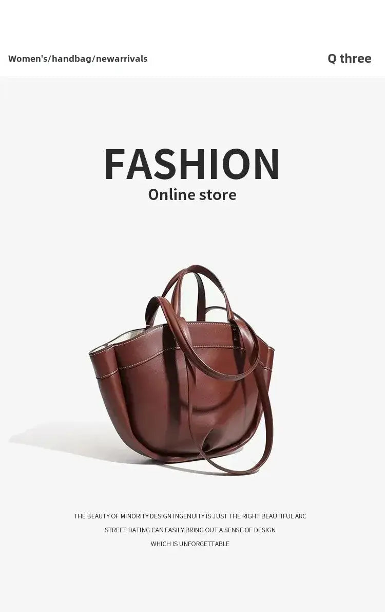 Fashionable large capacity brown tote bag in soft synthetic leather for women, perfect for commuting and shopping.