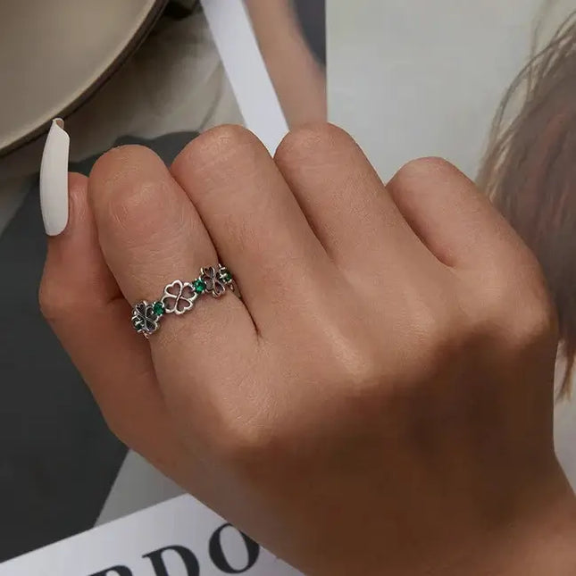 Lucky Cocktail Ring 925 Sterling Silver Zircon worn on a hand with stylish white nails, showcasing its unique design.