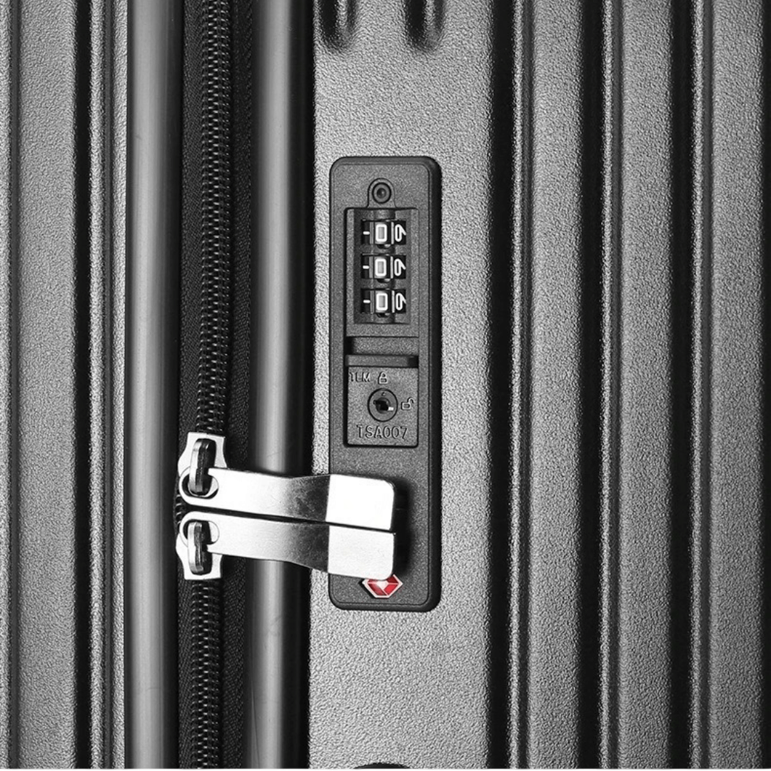 Close-up of a durable suitcase lock with combination dial and zipper system for secure travel.