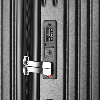 Close-up of a durable suitcase lock with combination dial and zipper system for secure travel.