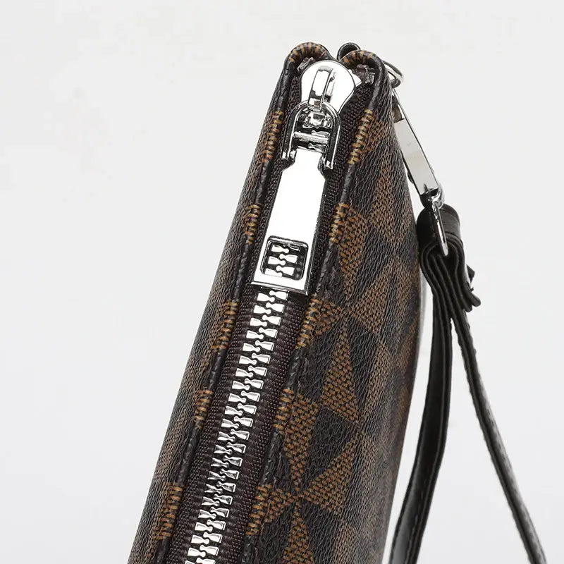 Men's leather clutch bag in brown plaid design featuring a secure zipper closure for stylish organization.