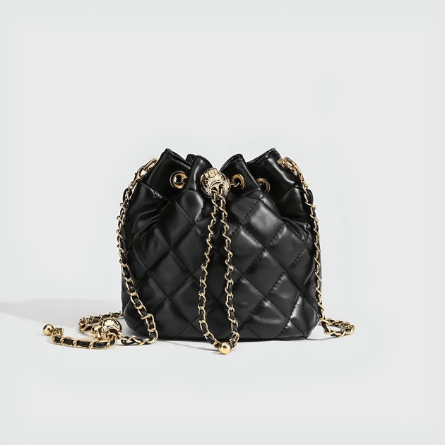 Black minimalist quilted drawstring bag with gold chain strap, perfect for any occasion.