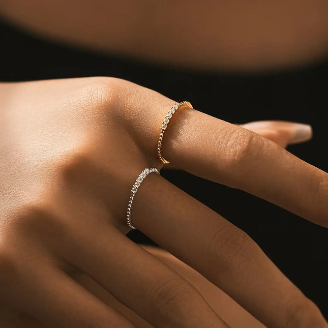 Moissanite Eternity Band Ring in 925 Sterling Silver worn on a hand showcasing its elegant design and sparkle.