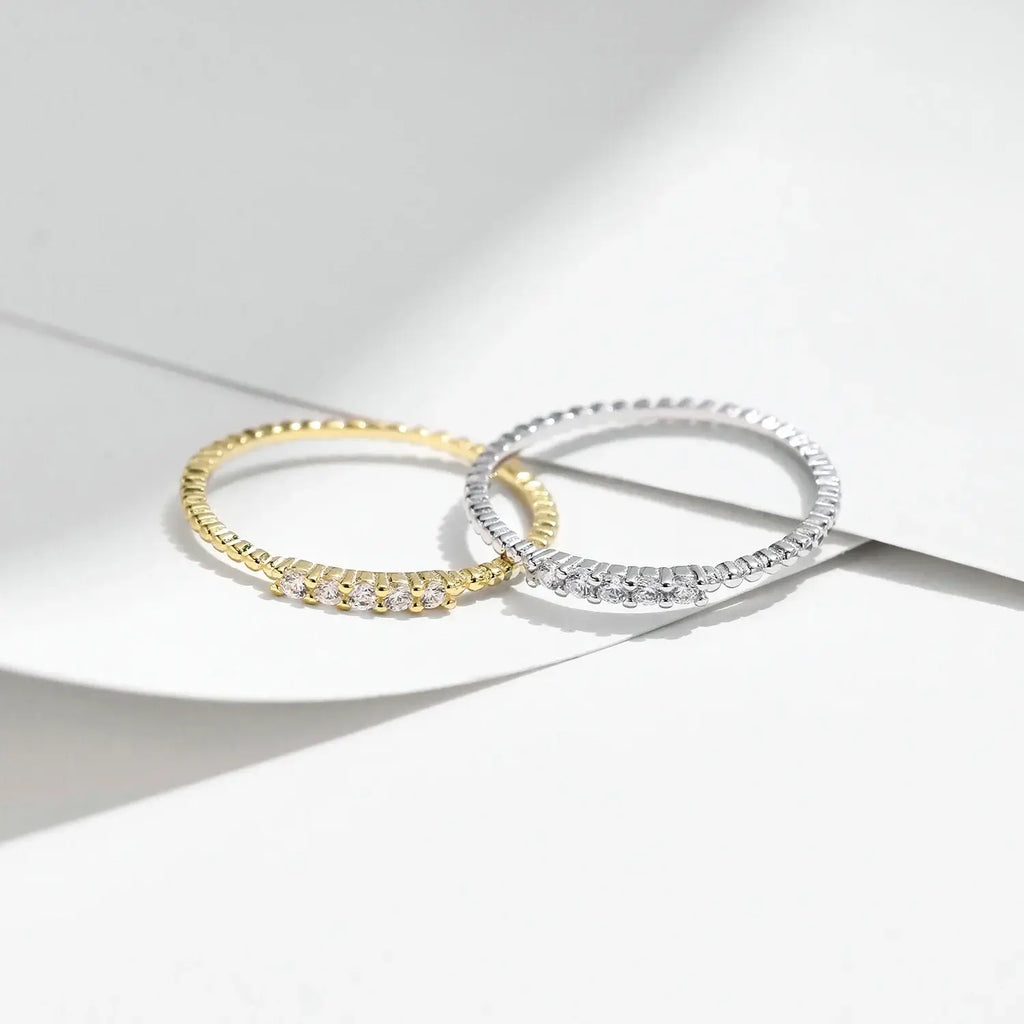 Moissanite Eternity Band Ring in 925 Sterling Silver with elegant design and sparkling stones on a minimalistic background.